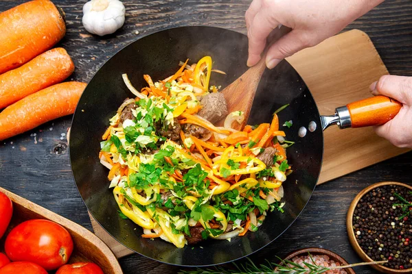 Woman Hands Stir Hot Vegetables Meat Wok Top View Close — Stock Photo, Image