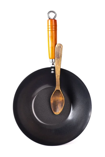 白いスプーンで木製のハンドルで調理するための大きな鍋 — ストック写真
