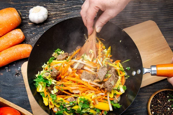 Cook Hands Stir Hot Vegetables Meat Wok Top View Close — Stock Photo, Image