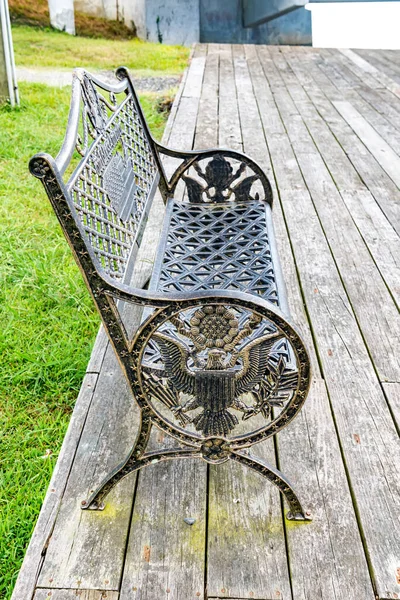Metal bench with American symbols - American flag, statue of liberty and eagle.