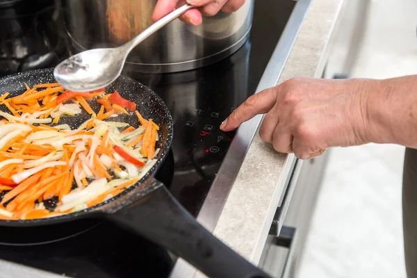 Chef Selects Operating Mode Electric Stove Touch Button Cooking Vegetable — Stock Photo, Image