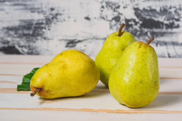 stock image pears on the white boards of the table, Close-up. Space for text