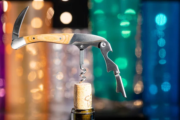Folding Universal Corkscrew Neck Wine Bottle Partially Removed Cork Background — Stock fotografie