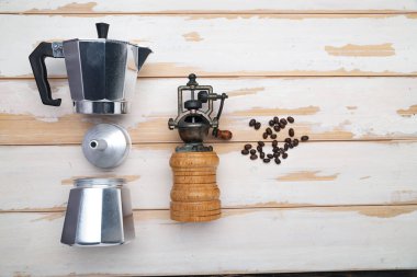 Geyser coffee maker, coffee grinder and fragrant coffee beans close-up. View from above. Space for text.