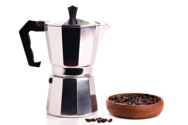 classic geyser coffeemaker and coffee beans closeup isolated on white background.