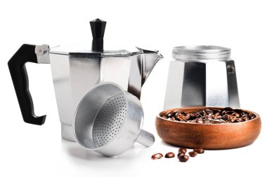 pieces of classic geyser coffeemaker and grain coffee closeup isolated on white background.