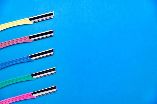 Women Razors Plastic Handles Different Colors Blue Background Space Text — Zdjęcie stockowe