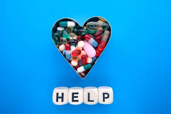 Blue Surface Pills Capsules Shape Heart Cubes Inscription Help — Stock Photo, Image