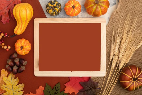 thanksgiving composition with letter board Happy Thanksgiving. Autumn pumpkins, acorns, and leaves. Flat lay. view from top