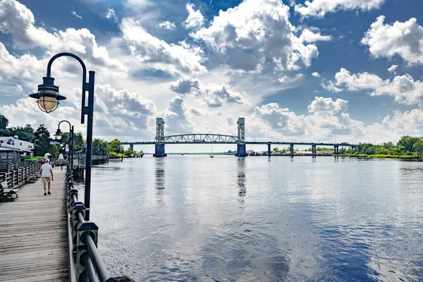 Stock image Riverwalk along the waterfront of the Cape Fear River overlooking Memorial Bridge Wilmington, NC