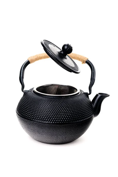 传统的黑色亚洲铸铁壶 开盖子 白色底座隔离 图库图片