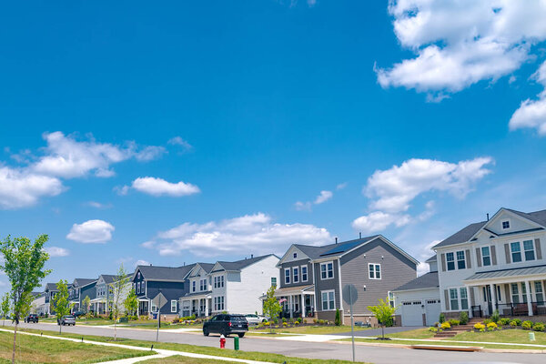 Suburban area. A block of residential detached houses along the road.