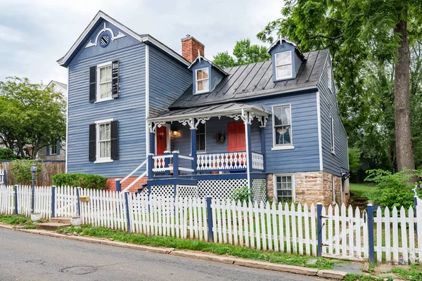 stock image old traditional American house with a veranda and carved facade.