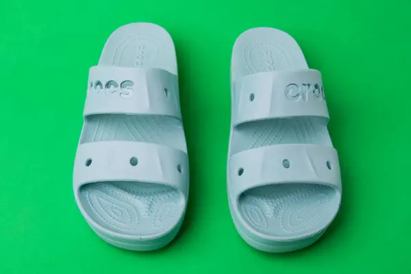 Comfortable Crocs Sandals Green Background Rubber Sandals Trendy Beach Shoes — Stock Photo, Image