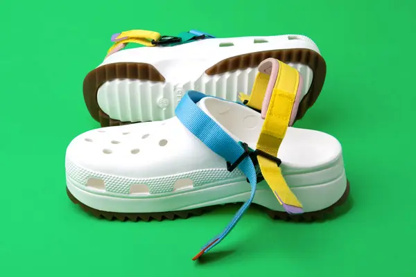 White Crocs Colored Straps Green Background Rubber Sandals Trendy Beach — Stock Photo, Image