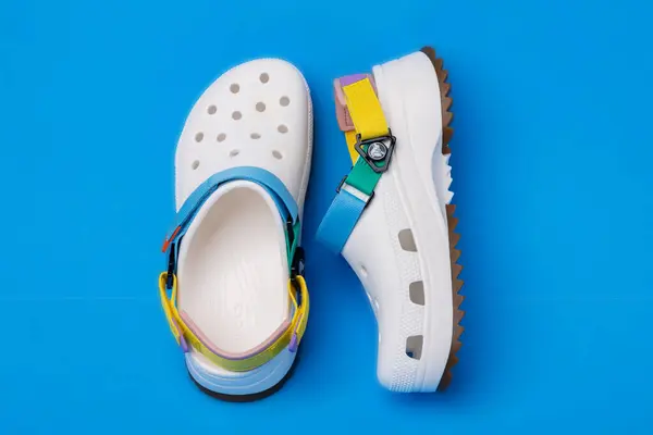White Croc Slippers Straps Blue Background Comfortabl — Stock Photo, Image