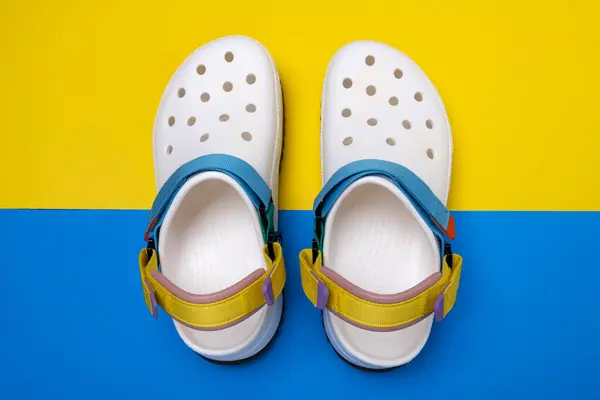 White Croc Slippers Straps Yellow Blue Background Comfortable Unisex Beach — Stock Photo, Image