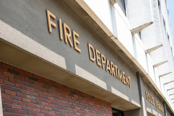 stock image The inscription FIRE DEPARTMENT at the entrance of the fire station Cumberland. Mariland.