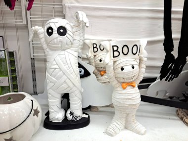 BOO dolls on a supermarket counter. Sale of Halloween decorations in a store. clipart