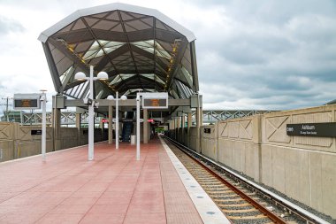 empty platform of the new Washington, D.C., subway station in Ashburn, Virginia. Open air. clipart