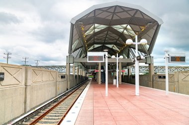 empty platform of the new outdoor subway station in Ashburn, Virginia.  clipart