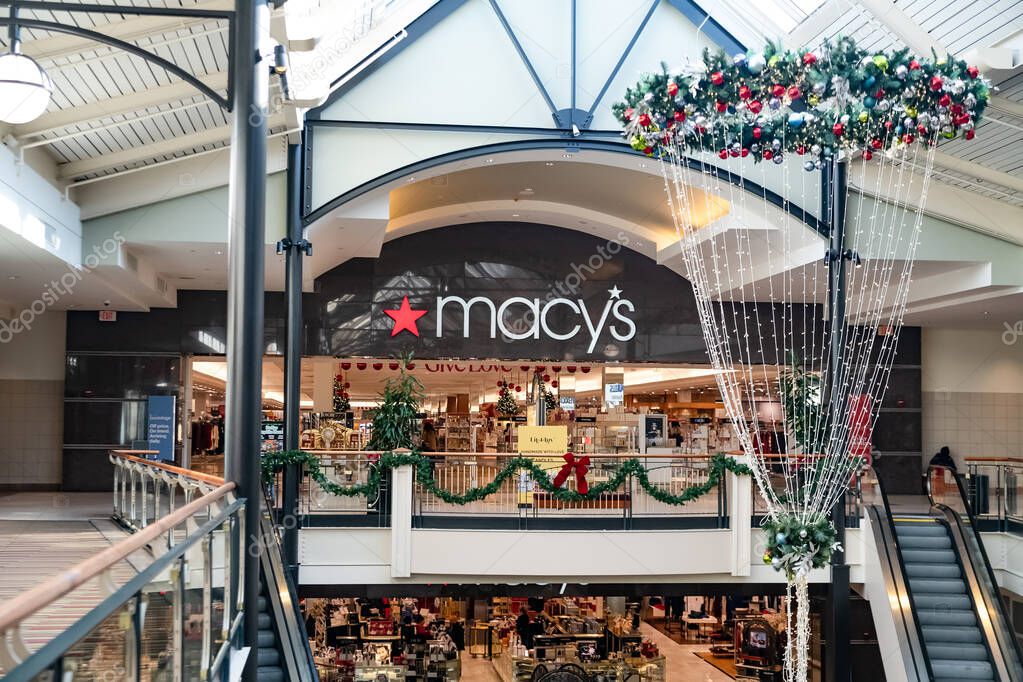 Macy's de-apartment store with Christmas decorations at the mall during Christmas sales.