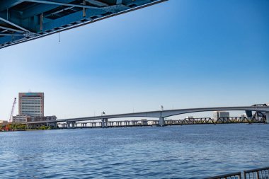 highway and railroad bridges over the Saint John's River in Jacksonville, Florida clipart