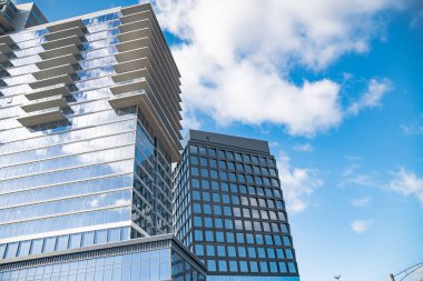 high-rise glass and concrete office building in Reston, Virginia. clipart