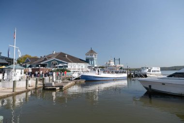 pier on the Potomac River waterfront in Old Town Alexandria, Virginia. Tourist spot. clipart