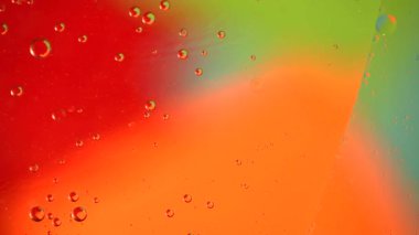 Soyut sıvı arkaplan. Yağ damlacıklarının dairesel hareketi.
