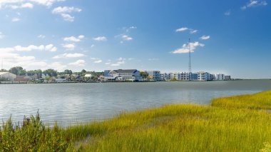 Chincoteague, a landscape of waterfront hotels and inns. Popular tourist destination on the East Coast. clipart