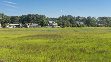 Chincoteague, landscape with houses on the shore! at the entrance to the island. A popular tourist destination on the East Coast. clipart