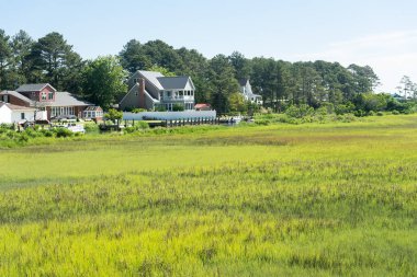 Chincoteague, landscape with houses on the shore! at the entrance to the island. A popular tourist destination on the East Coast. clipart