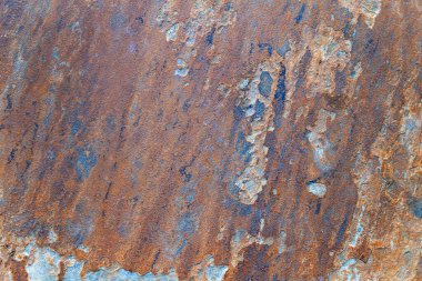 Topraksı kahverengi ve turuncu tonlarda doğal taş dokusu. Kabataslak mineral yüzeyi arka plan ya da tasarım elementleri için idealdir.