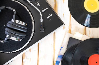 Vintage record player and headphones. Top view. clipart