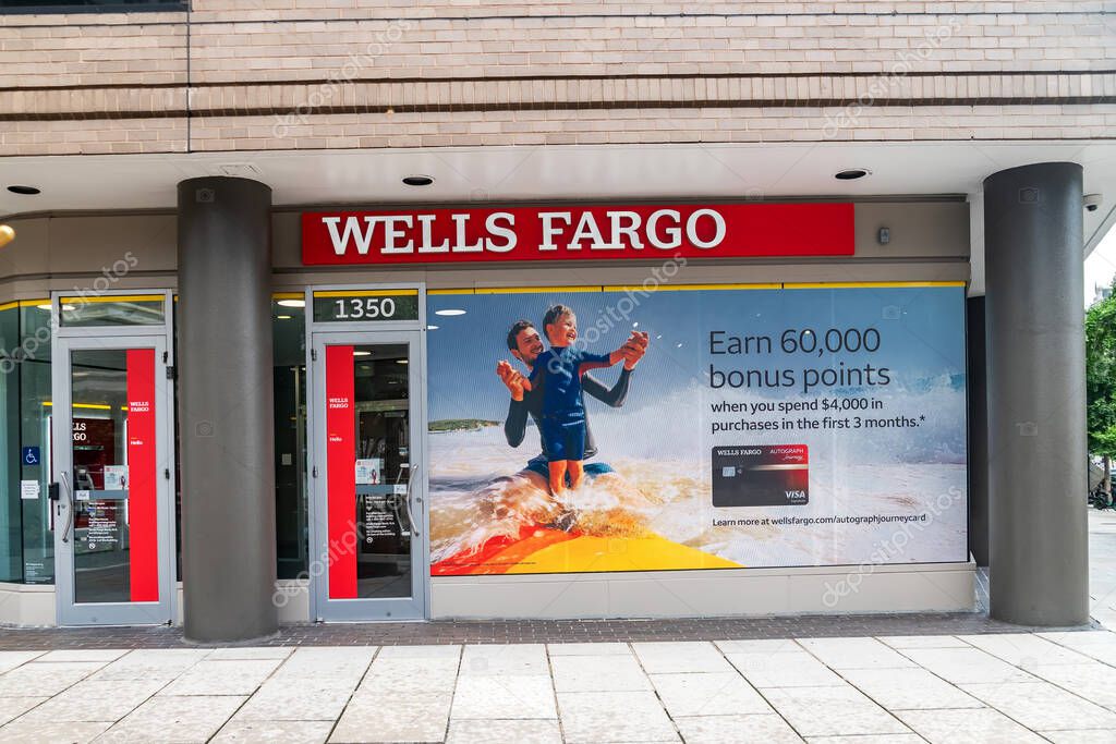Glass storefront with advertisements at the Wells Fargo Bank in downtown Washington DC.