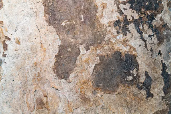 Yaş ve paslanmış taşın soyut arkaplanı