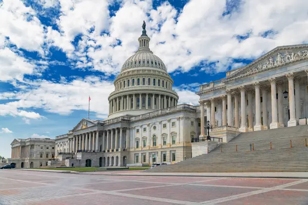Iconic U.S. Capitol Building Under Blue Sk