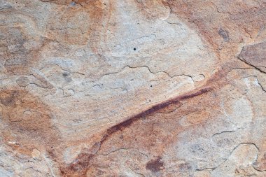 Sıcak tonlu taştan bir desen. Yaratıcı arkaplanlar için mükemmel.