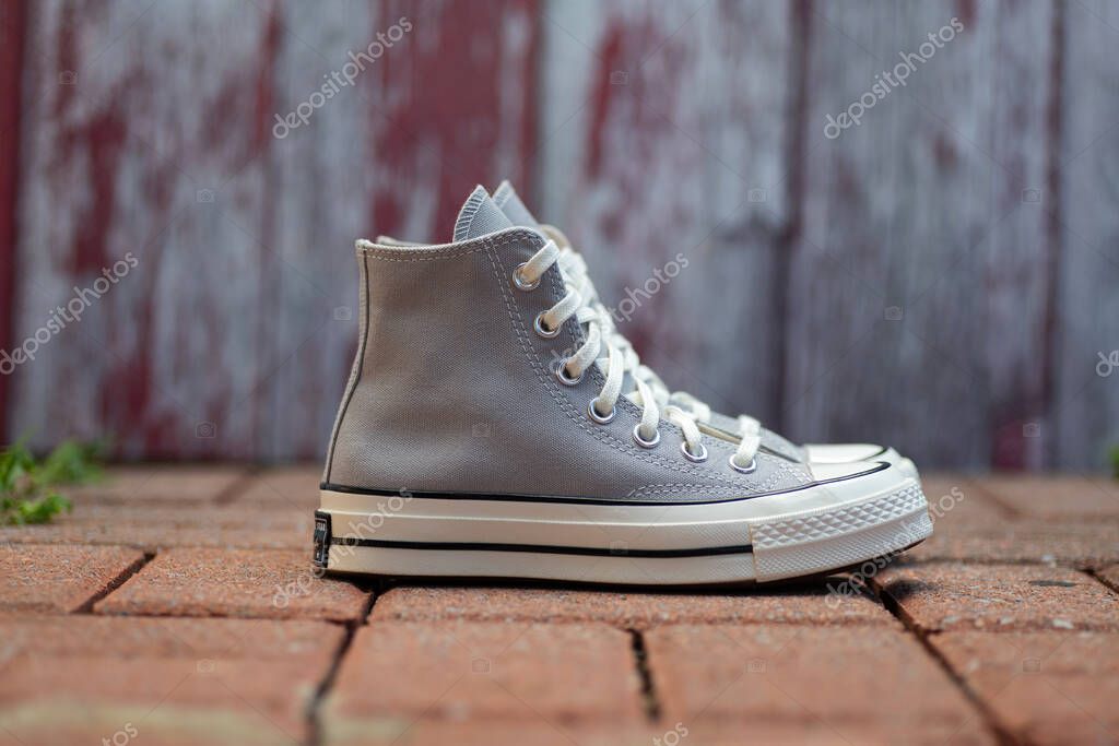 Vintage-Inspired High Tops. Minimalist gray sneakers styled for everyday cool.