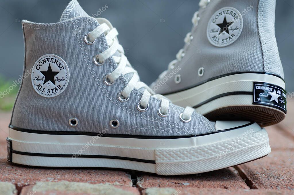 Everyday Sneakers Converse in Focus. Urban texture meets clean design in footwear shot.