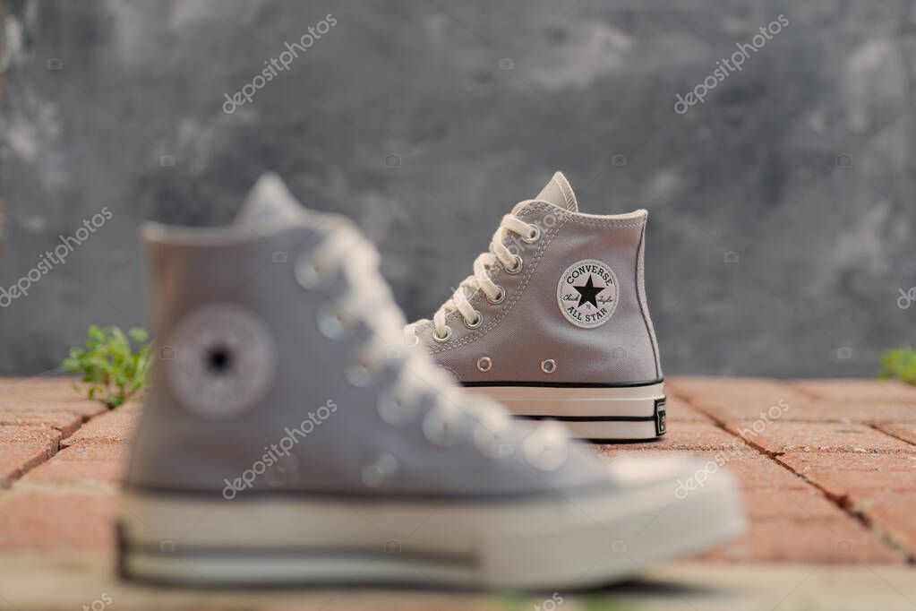 Retro-Inspired Urban Footwear. High-top sneakers Converse  with vintage charm and clean lines.