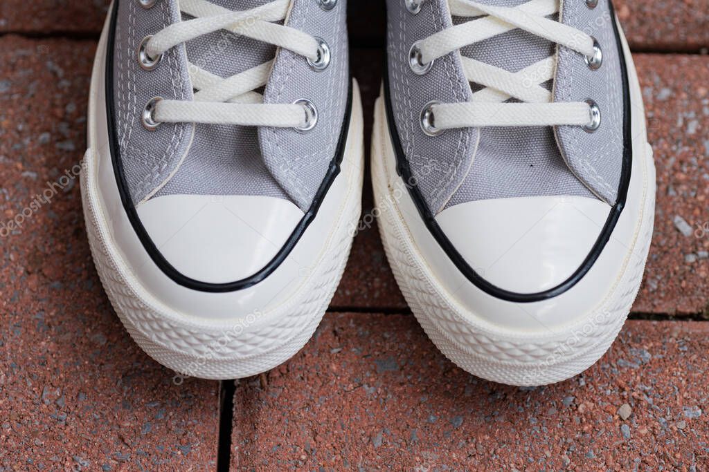 Street Style Simplicity. Neutral canvas shoes Converse captured in natural light.