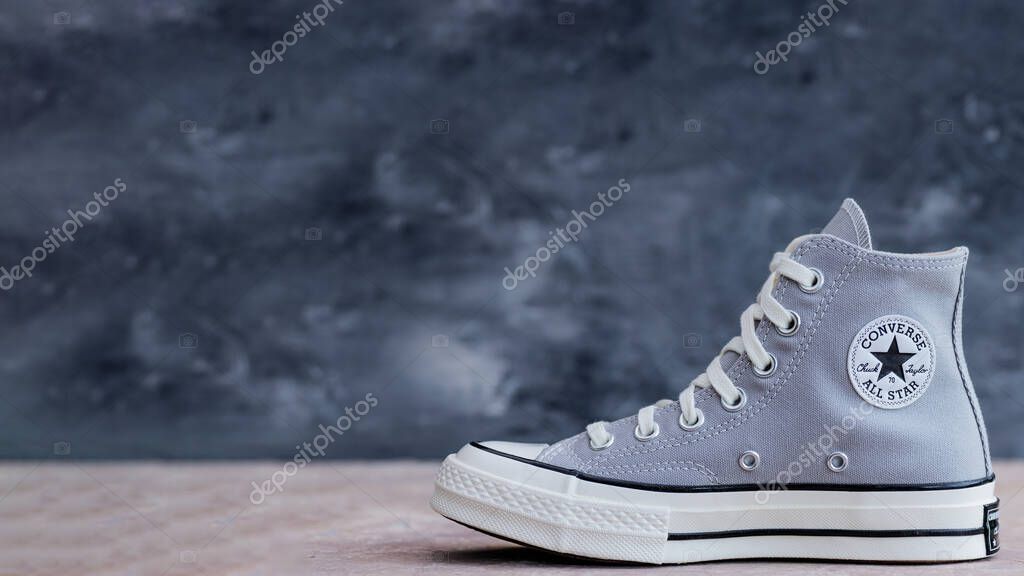 Trendy Street Style Shoes Converse. Neutral-toned canvas sneakers in natural light. Space for text.