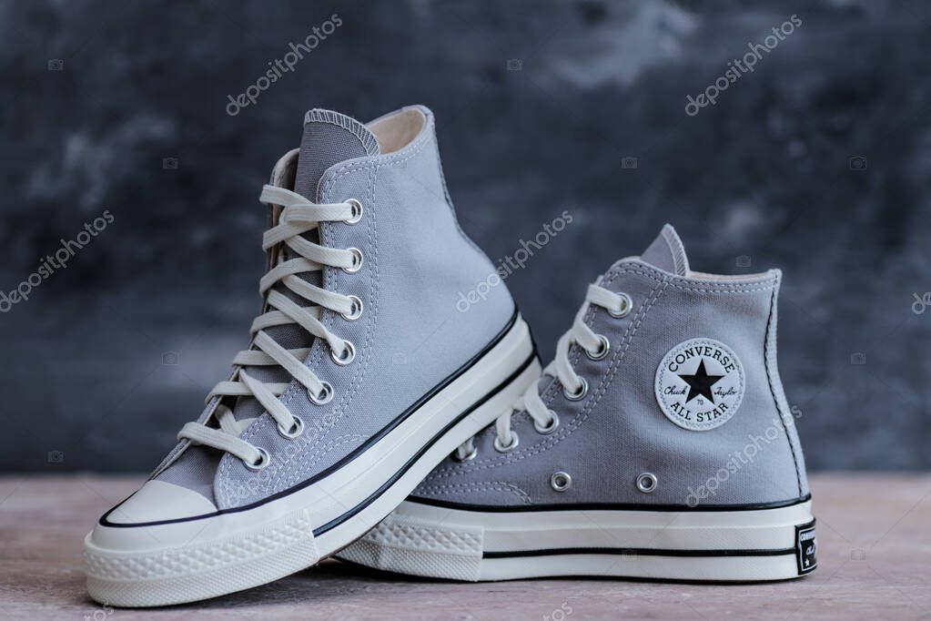 Casual Trend Essentials. Neutral canvas sneakers  Converse styled  for modern living.