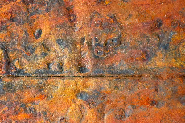 Portakal taneleriyle paslanmış çelik. Grunge yüzeyi.
