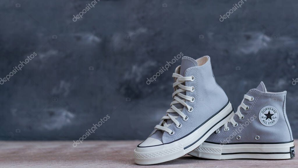 Effortless Streetwear Style. Classic gray high-tops Converse for urban lifestyle looks.