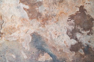 Oksitlenmiş desenli kaya yüzeyinin makro görüntüsü, çatlaklar ve sert taş ayrıntıları..