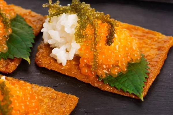 stock image Inari sushi with caviar, rice, shiso and umibudo