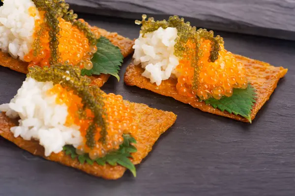 stock image Inari sushi with caviar, rice, shiso and umibudo